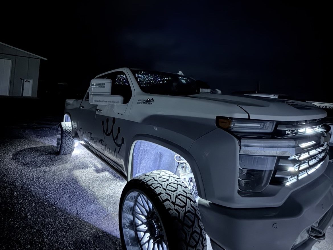 Dirty Bird Diesel crown truck at night with white underglow